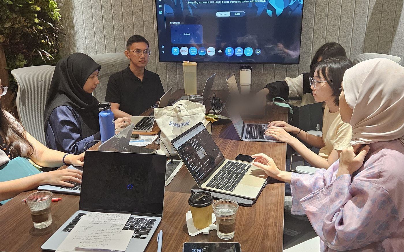 A research team coordinating a study around a table