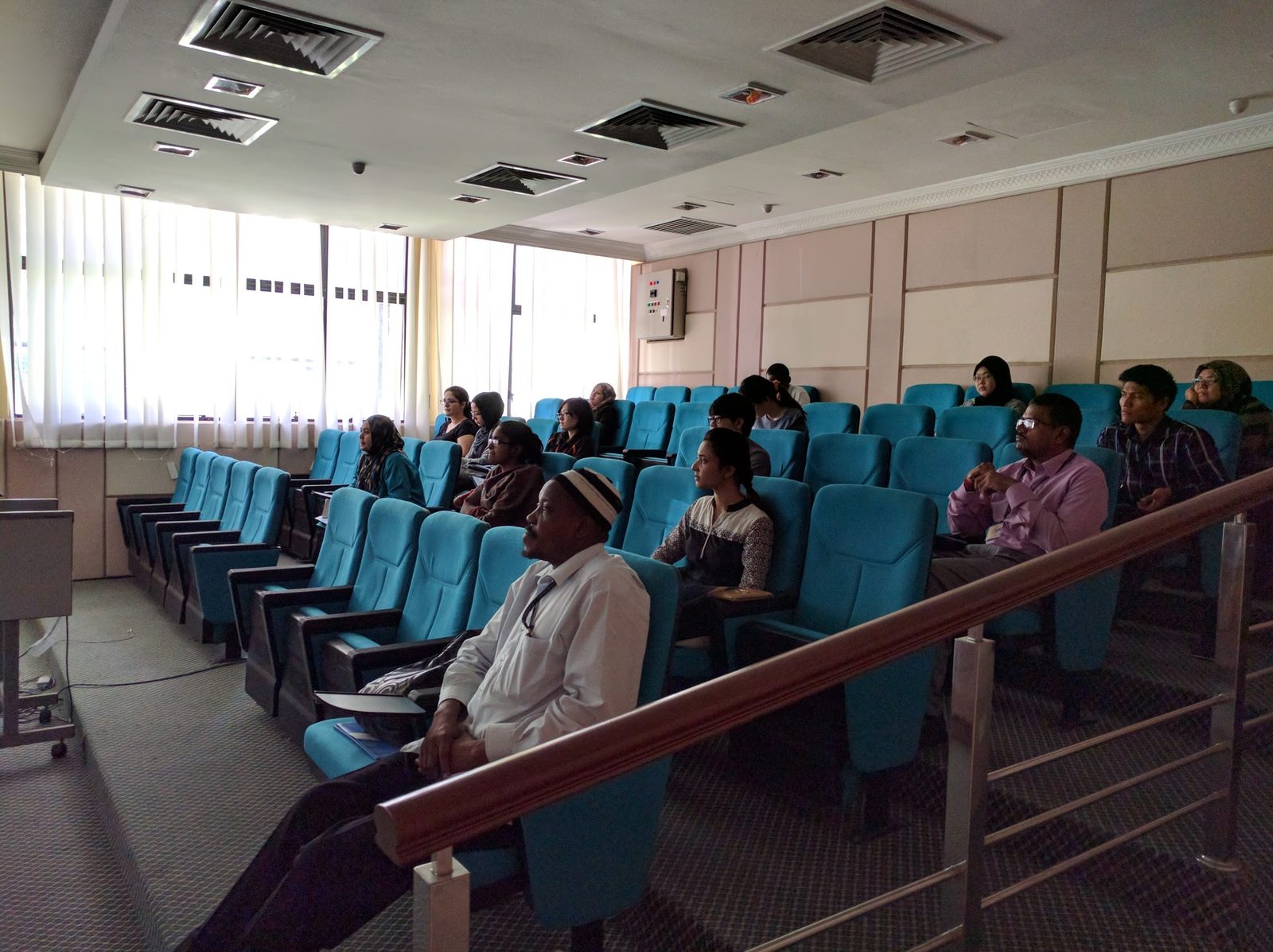 Participants seated in a tiered seminar room during the workshop talk