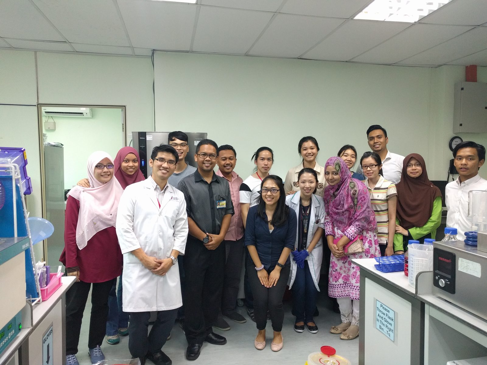 Workshop participants and trainers stand together for a group photo in the UKM Toxicology Lab