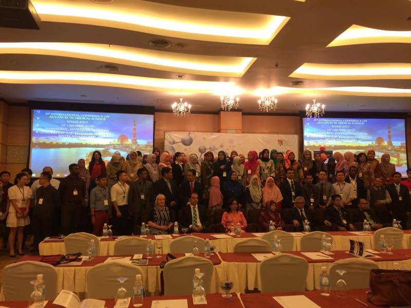 Conference delegates standing together for a group photo in the ICAMS 2017 hall at Marina Bay Putrajaya