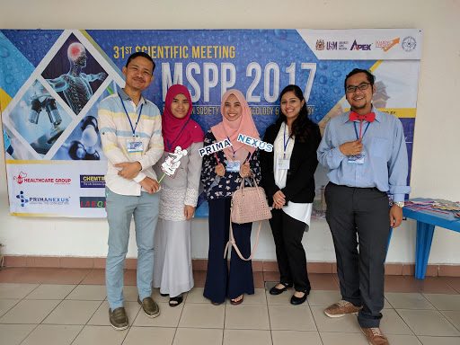 Five delegates in front of the MSPP 2017 banner, one holding a Prima Nexus sign; sponsor logos at bottom left.
