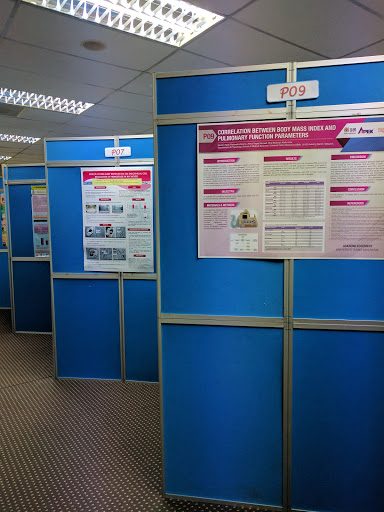 Research posters displayed on blue poster boards at the meeting.
