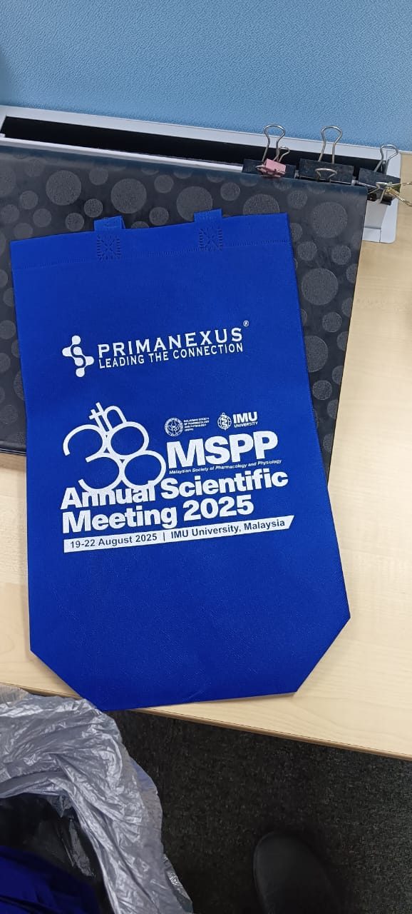 Blue conference bag printed with the Prima Nexus logo and the 38th MSPP Annual Scientific Meeting 2025 artwork