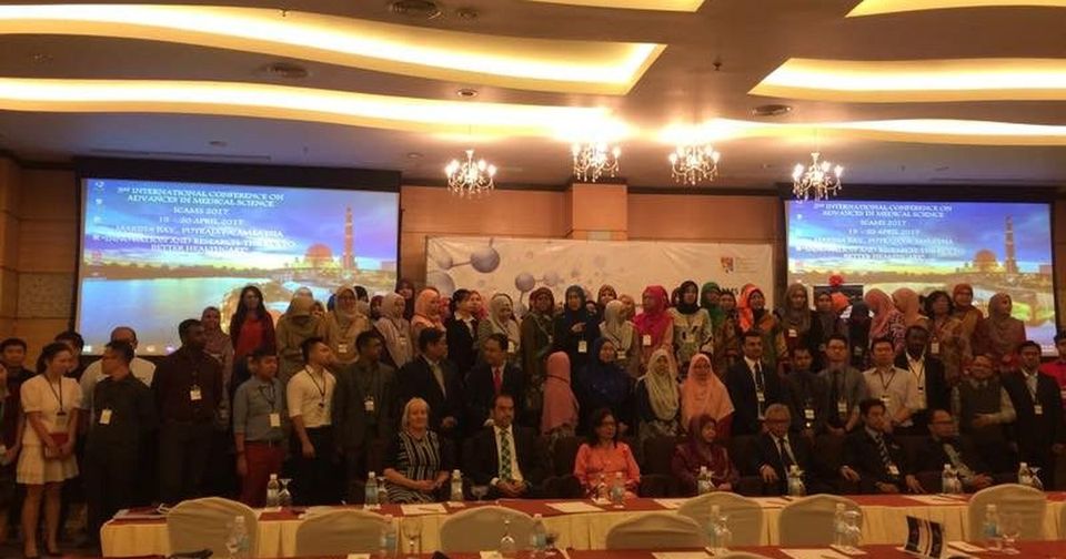 Conference delegates standing together for a group photo in the ICAMS 2017 hall at Marina Bay Putrajaya