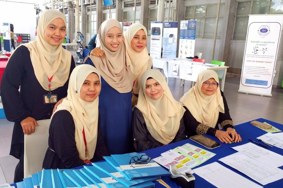 Six women at the registration desk at Centrepoint, Faculty of Medicine, Universiti Malaya