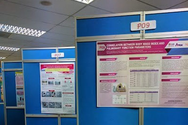 Research posters displayed on blue poster boards at the meeting.