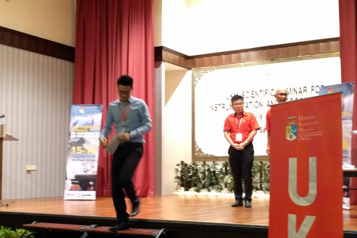 The stage of the seminar hall, with a UKM banner beside it