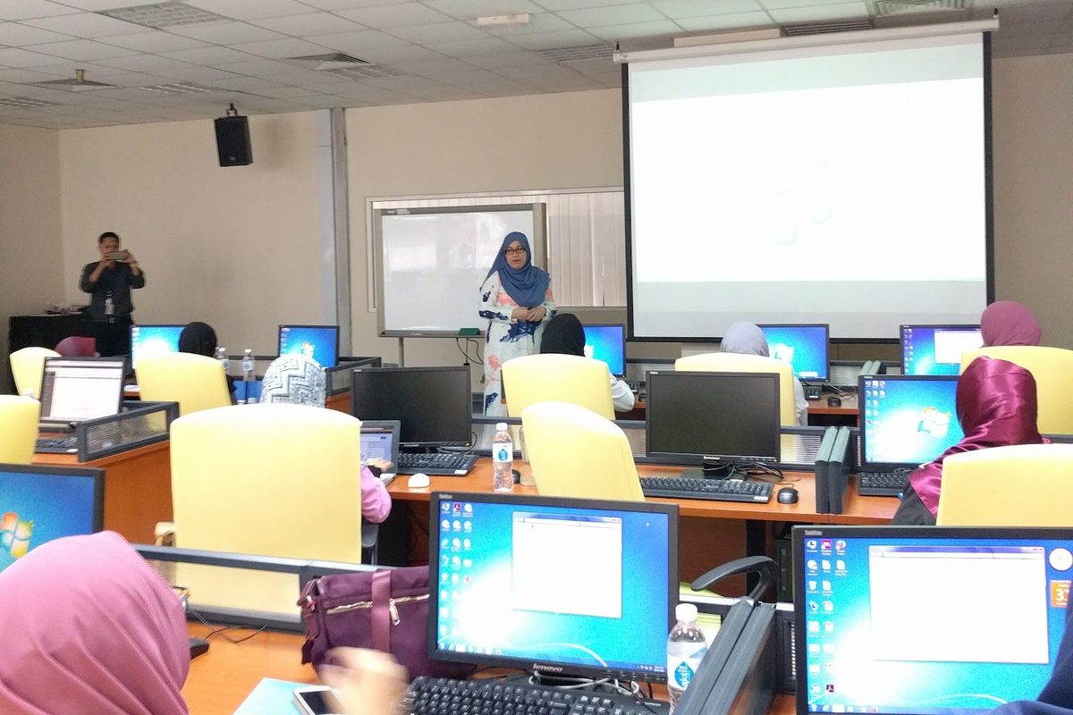 Participants at computers following the presenter’s slides
