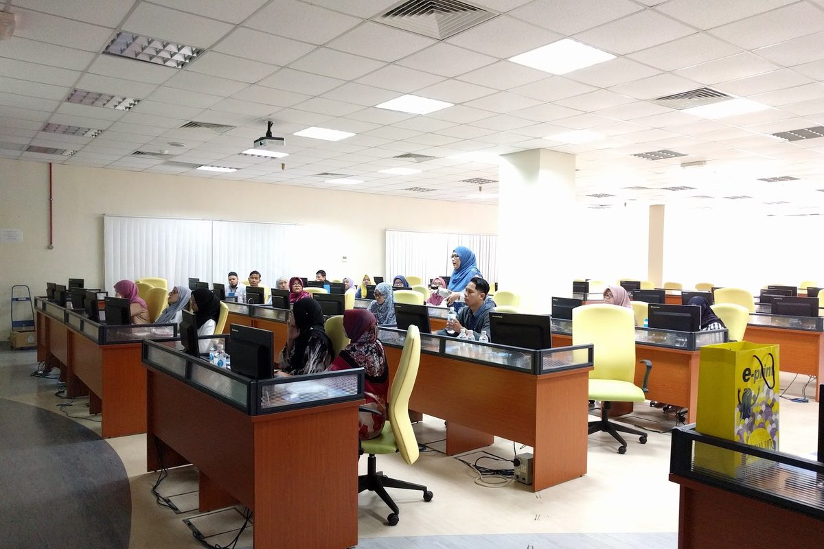 The computer laboratory with participants at rows of desks