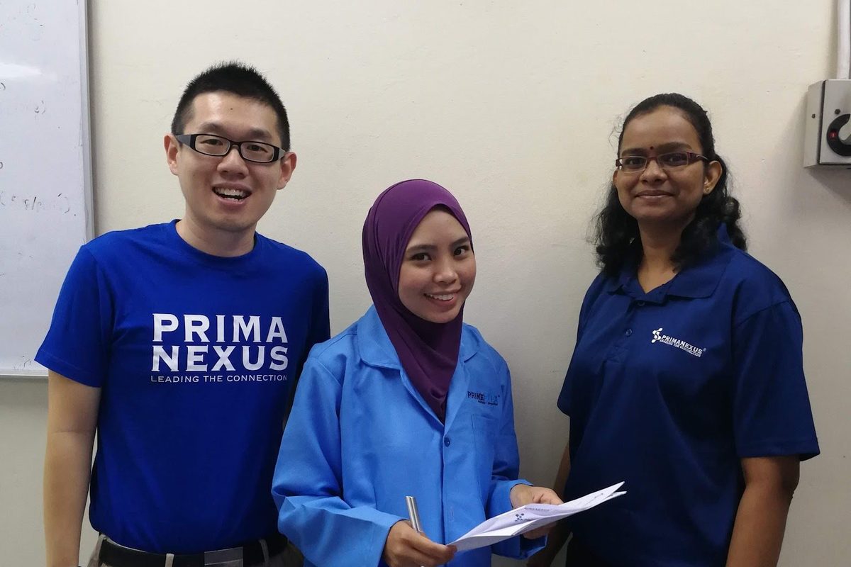 Three members of the workshop team in the laboratory