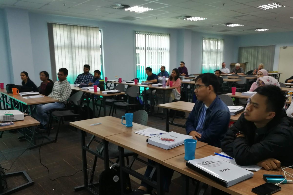 Participants working at computers in a computer laboratory