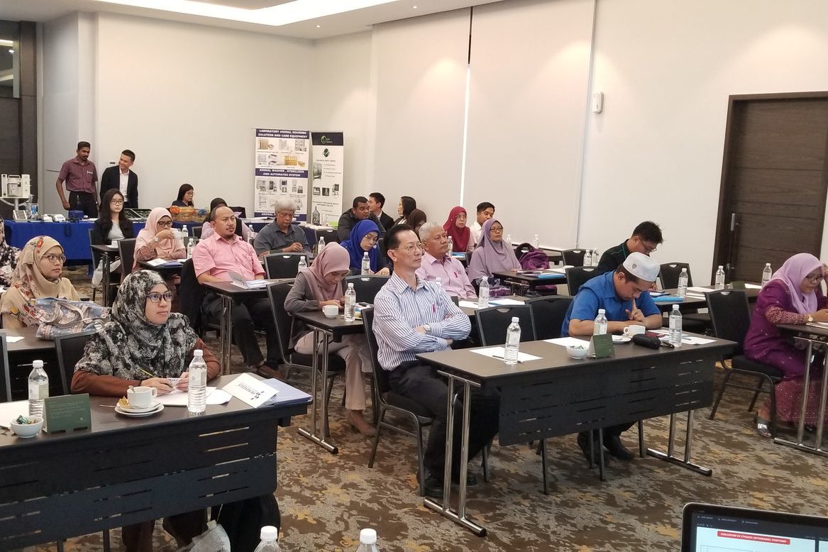 LASAM members seated at long tables in a hotel meeting room during the seminar