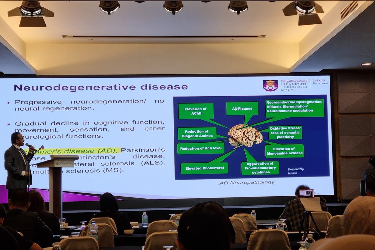 A speaker presents a slide on neurodegenerative disease to the conference hall