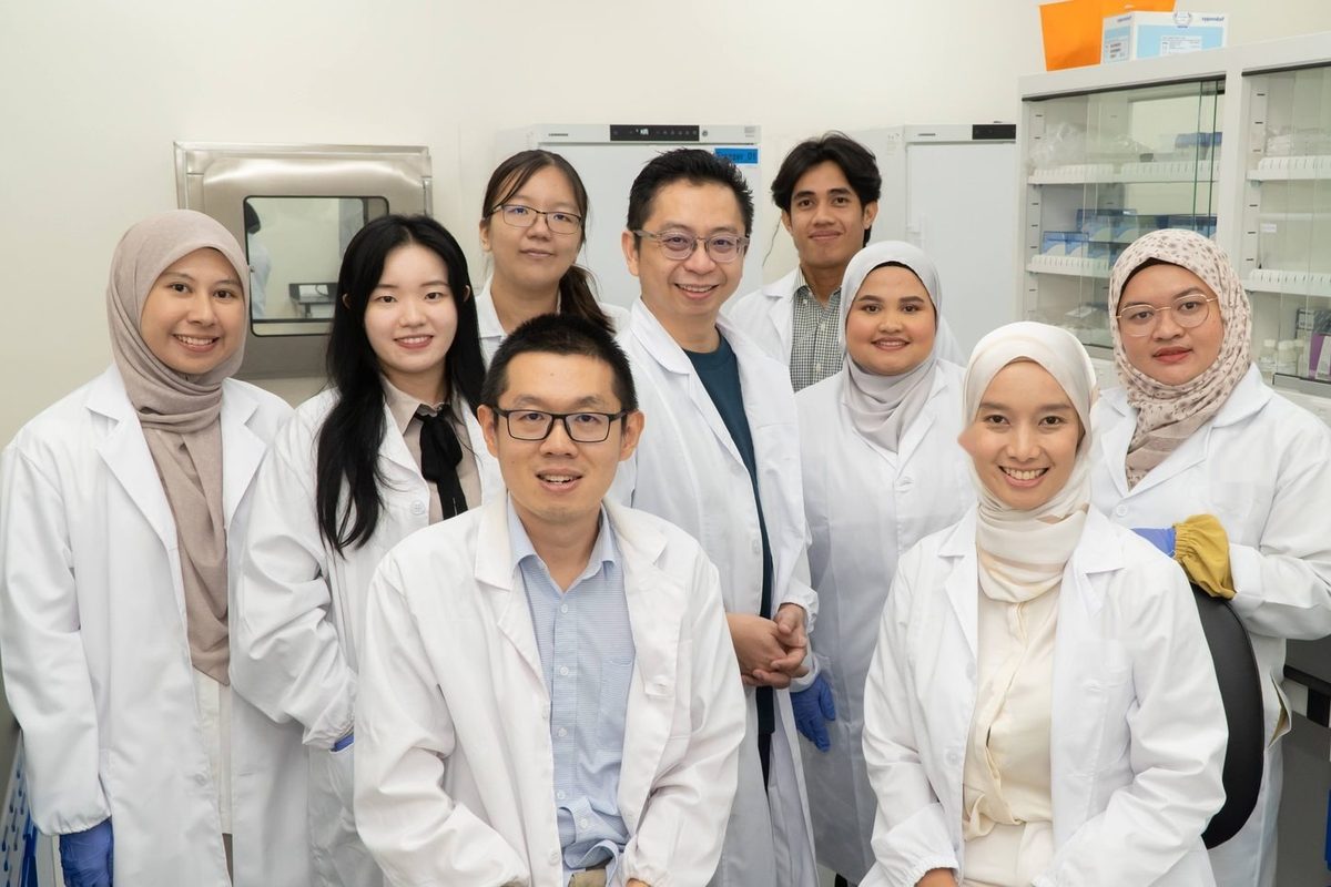 A research team in lab coats in a laboratory