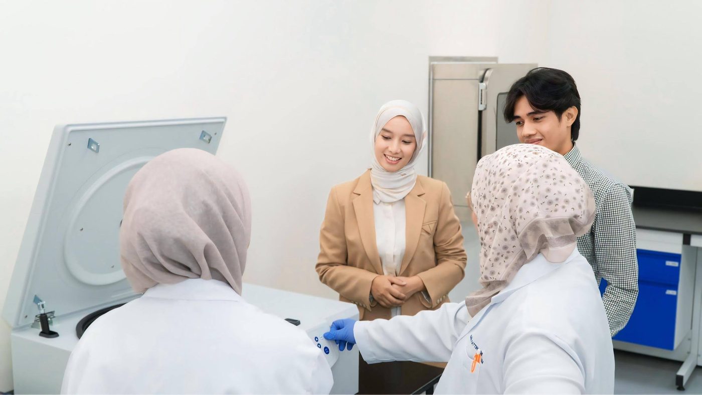 Prima Nexus scientists reviewing results together in the laboratory
