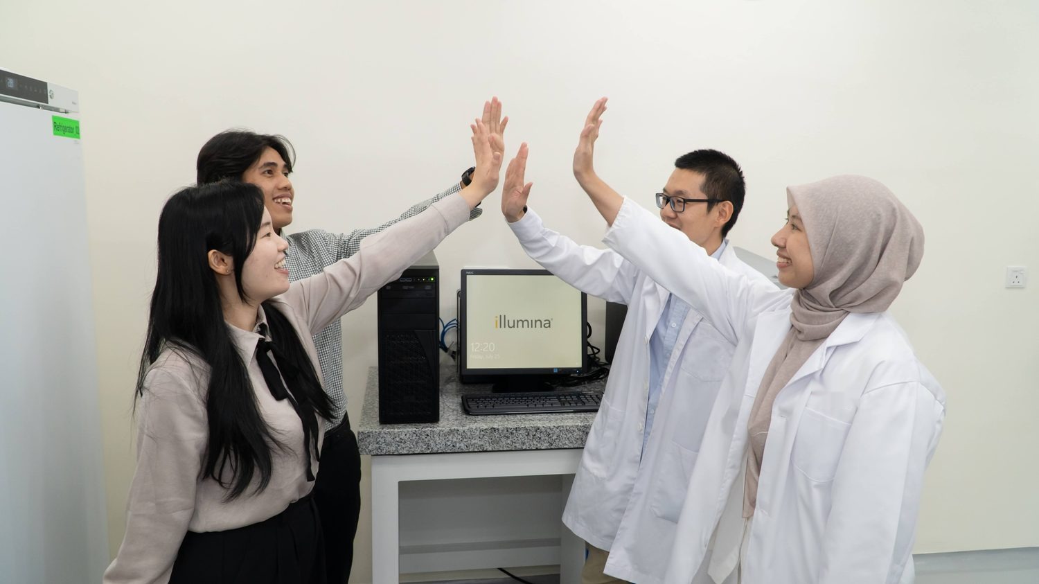 Colleagues celebrating in the laboratory