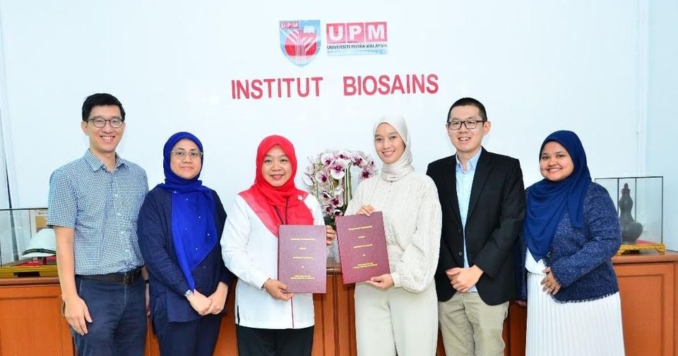 Prima Nexus and UPM Institute of Bioscience representatives holding the renewed MoU documents