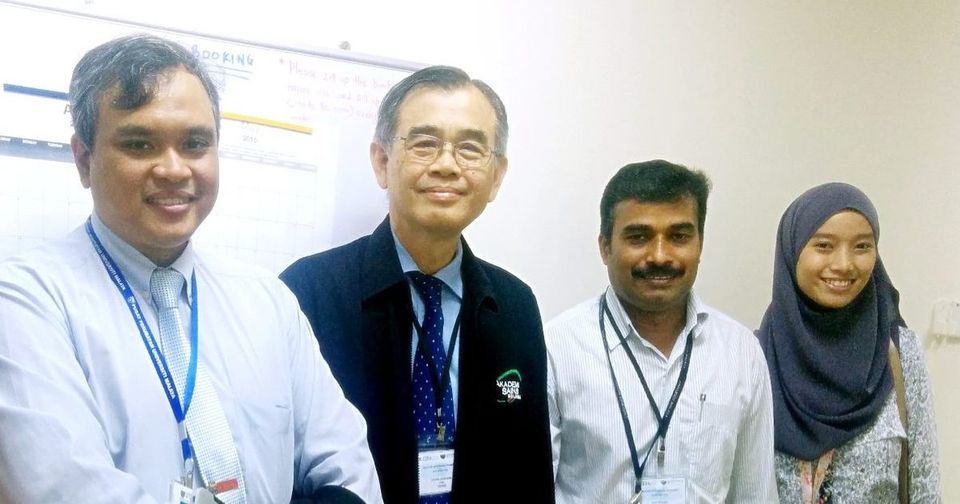 Four people taking part in the stem cell programme stand together for a photo in a corridor