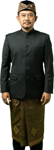A Javanese man in a blangkon headcloth, black jacket and batik